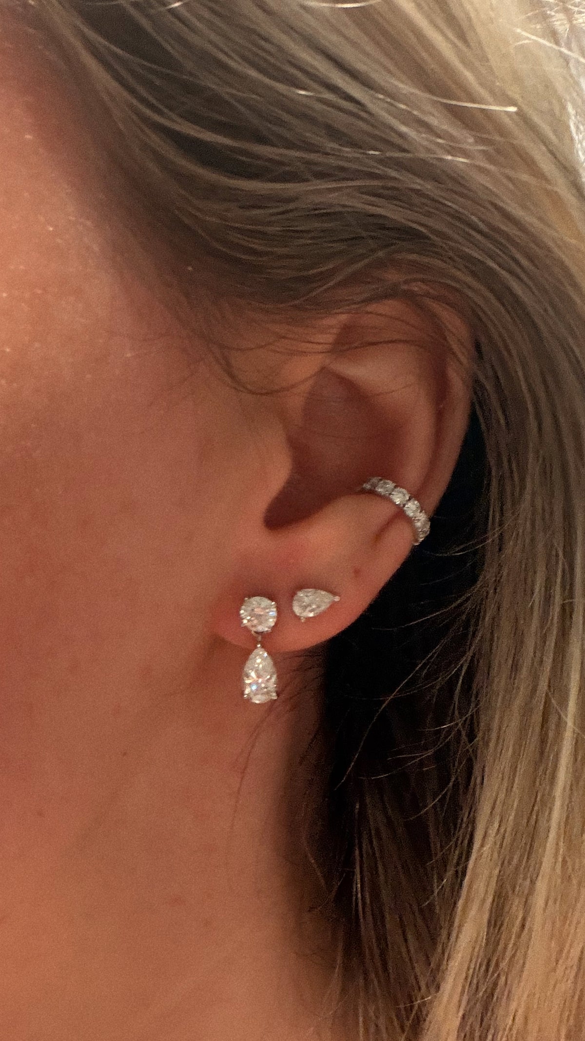 Davey Ear Cuff worn on the upper ear with round, pear and oval earrings.