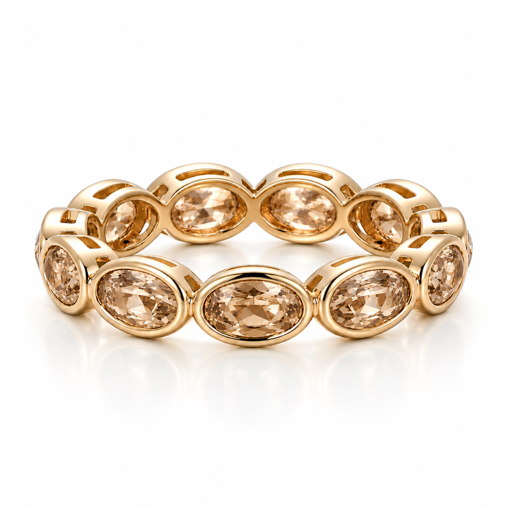 Oval Bezel Eternity Band in yellow gold with champagne moissanite