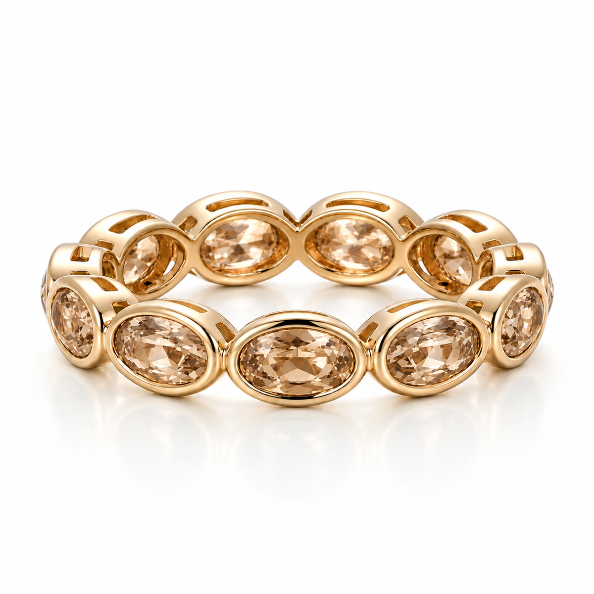 Oval Bezel Eternity Band in yellow gold with champagne moissanite