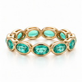Oval Bezel Eternity Band in yellow gold with green moissanite