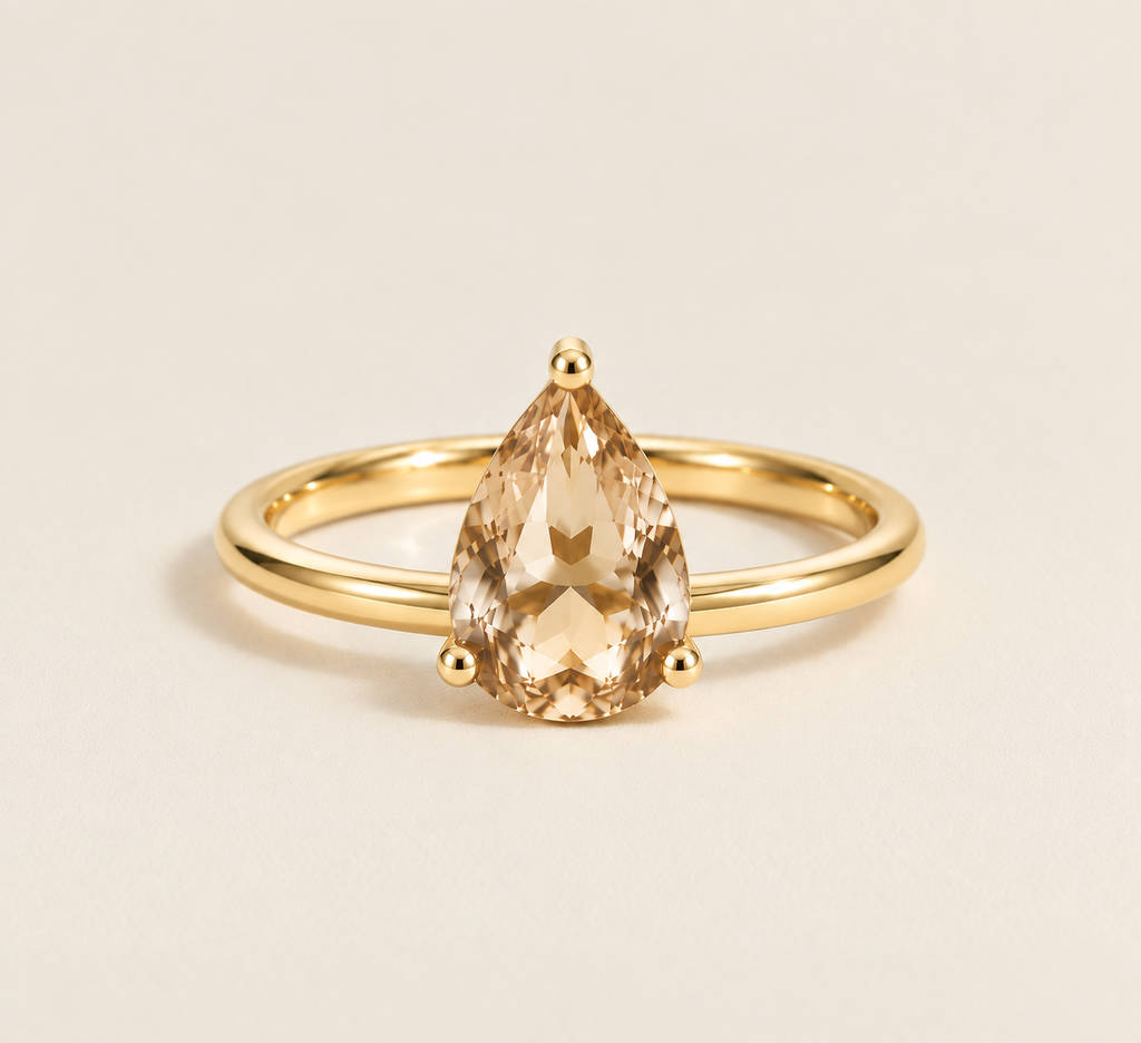 Pear Solitaire Ring in yellow gold with champagne moissanite