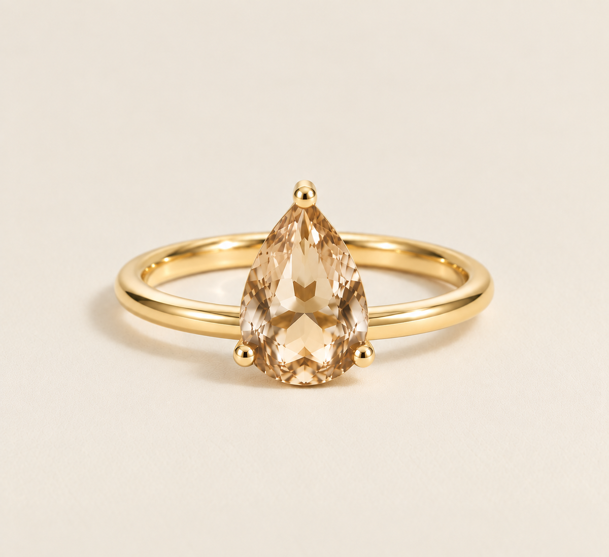Pear Solitaire Ring in yellow gold with champagne moissanite